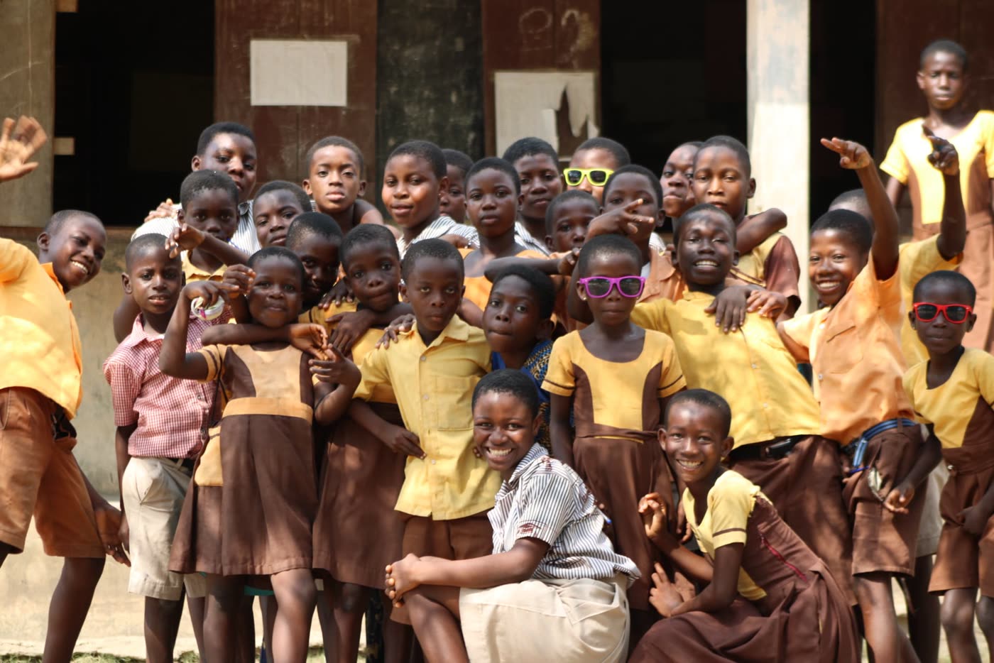 Smiling students at a partner school