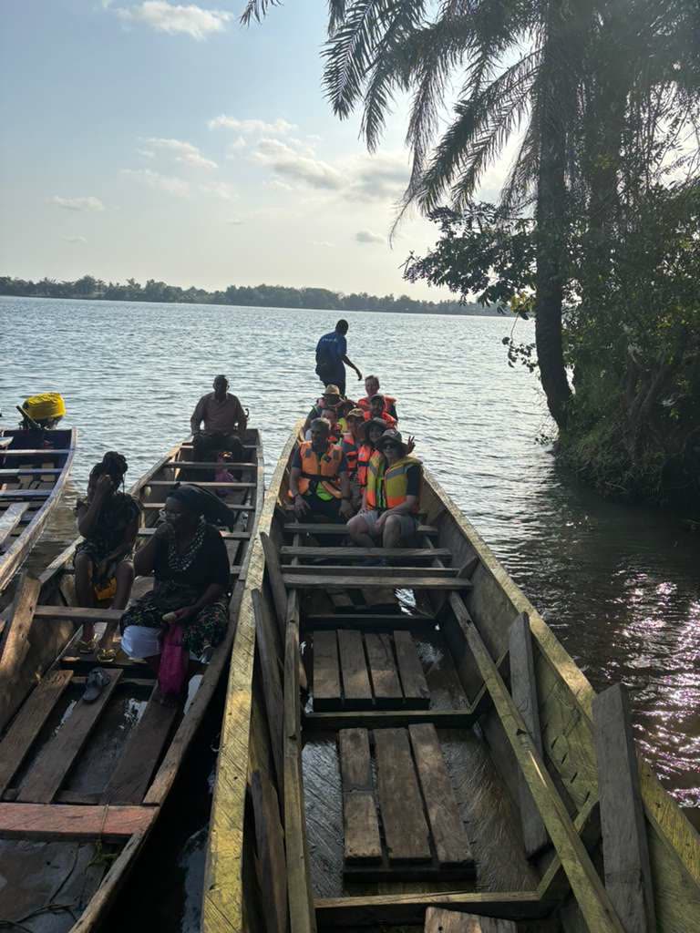 Wooden canoes moored on the Volta River
