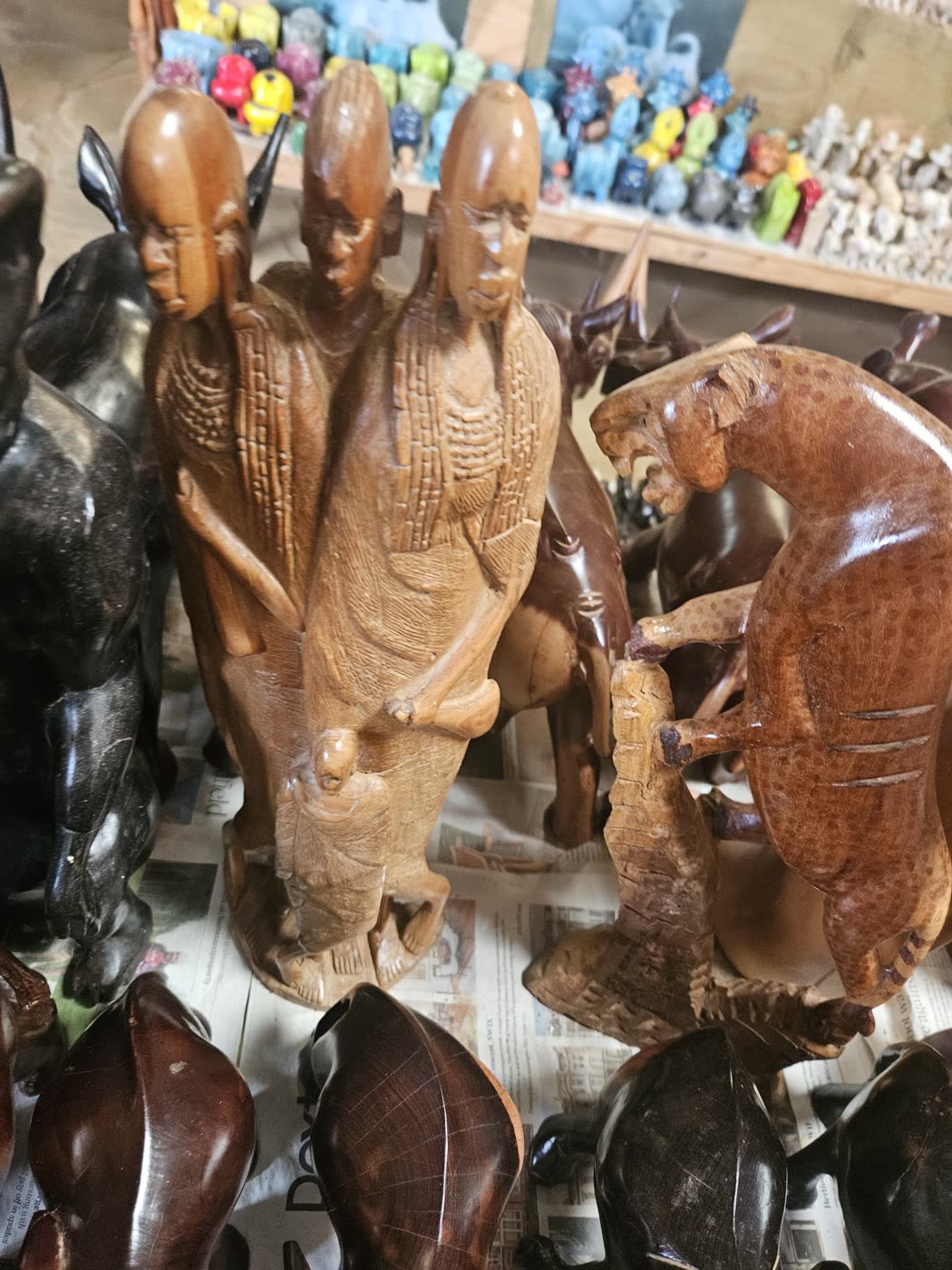 Hand-carved wooden figures at a craft market