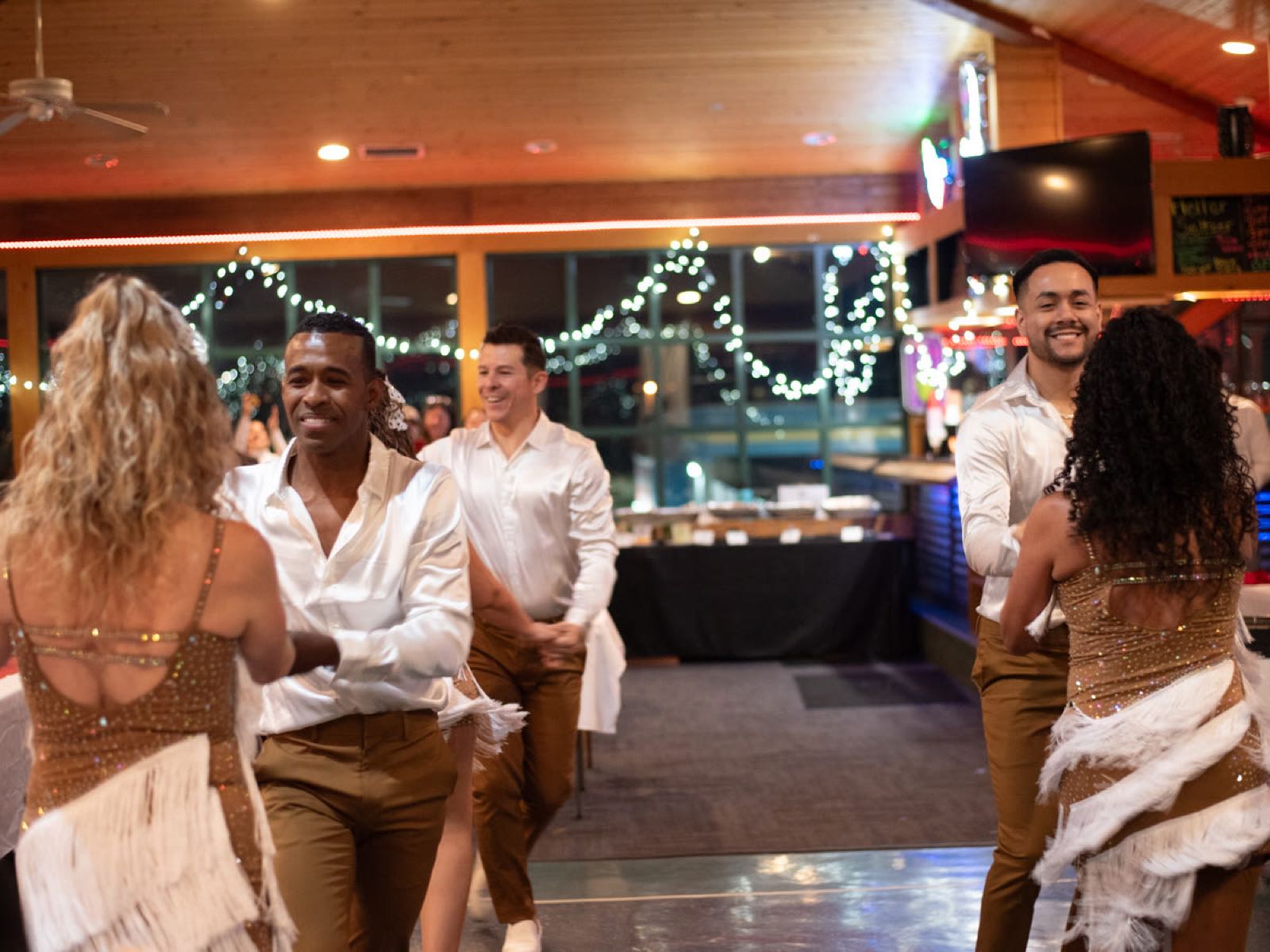 Dancers performing on the dance floor at our 2023 holiday gala