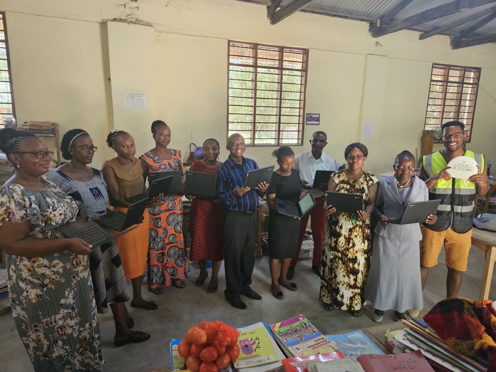 Teachers at Mijomboni Primary in Kenya in a refurbished classroom