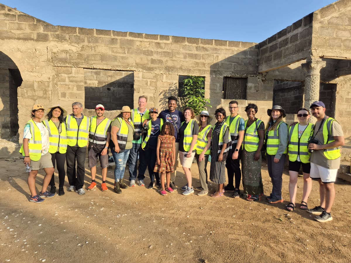 Dreamers Wish Foundation volunteers with community members at a partner school in Ghana